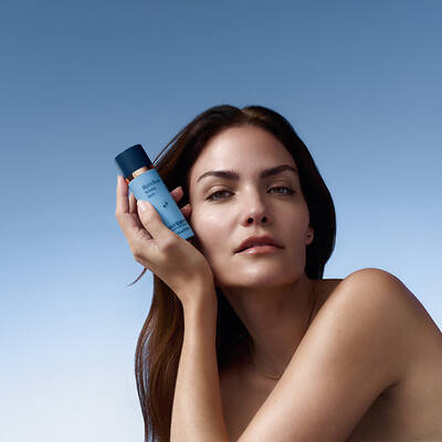 Three skinbetter science products lined up horizontally on a pale grey surface